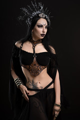 Woman in gothic suit and silver crown