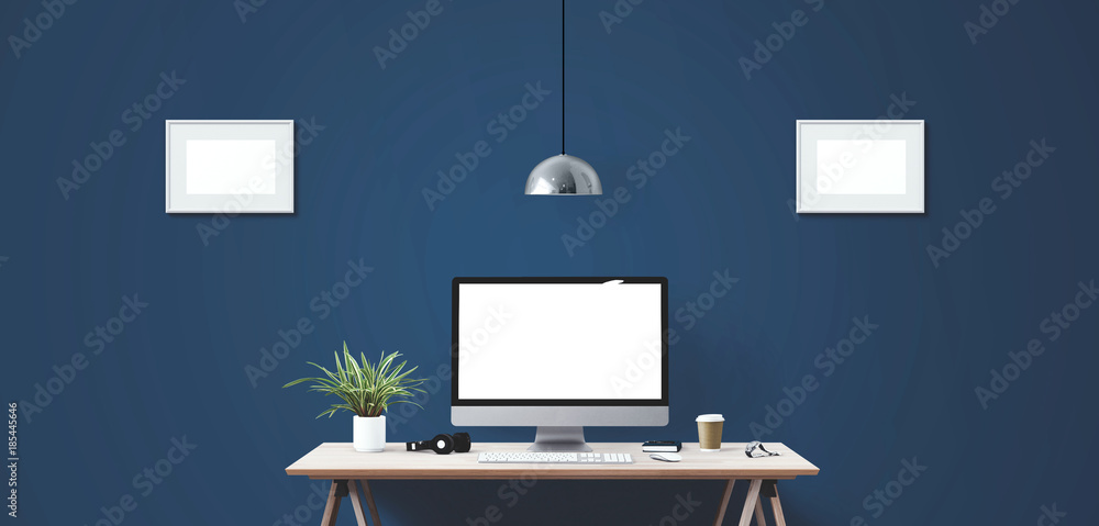 Wall mural computer display and office tools on desk.
