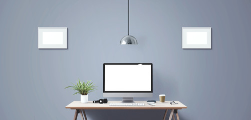 Computer display and office tools on desk.