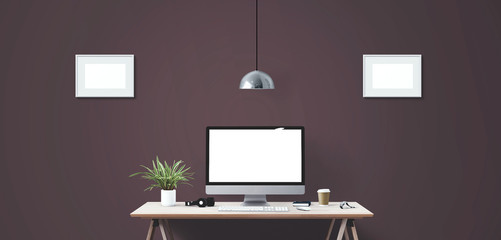 Computer display and office tools on desk.