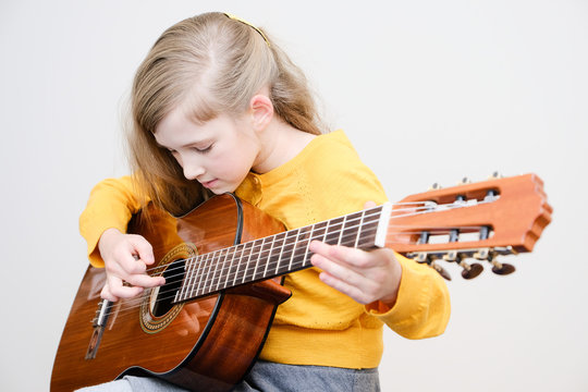 Girl Playing Acustic Guitar