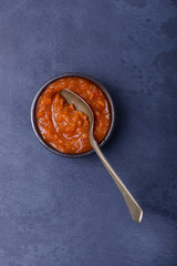 Sauce and spoon in bowl