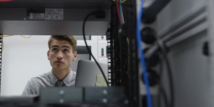 A Man Working In A Server Room. Shot on RED Helium 8K
