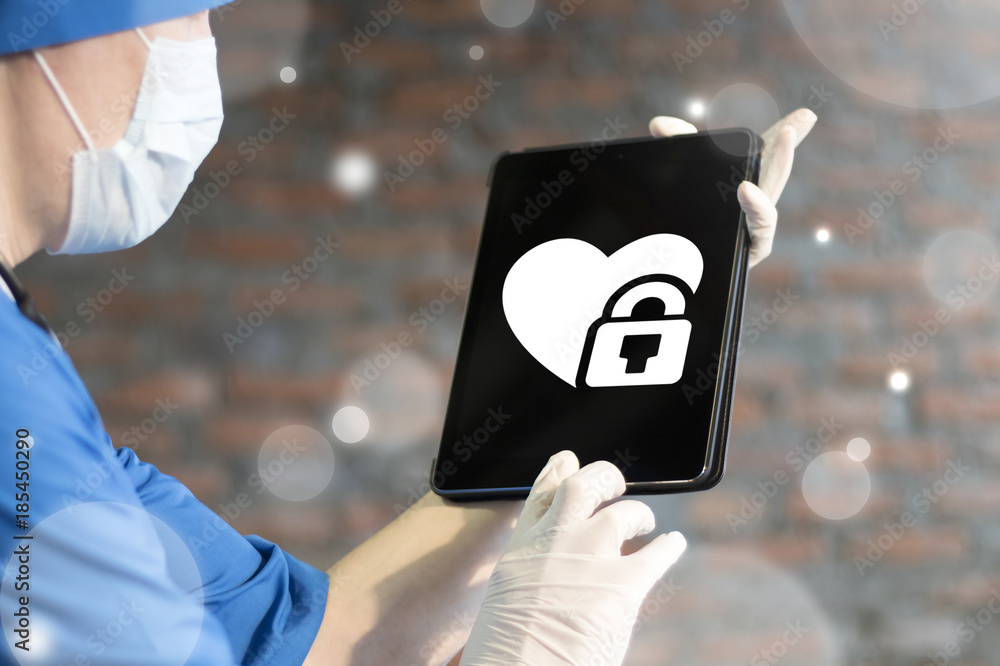 Poster doctor using tablet computer with heart padlock icon on display. secure mobile medicine application.