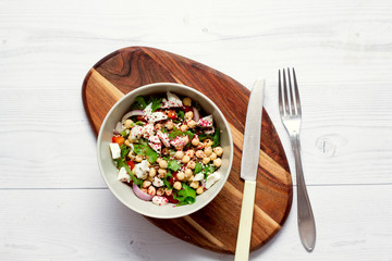 Vegetable salad with fresh lettuce, tomatoes with sesame seeds for vegetarians.