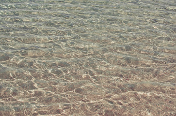 Sea or ocean with crystal clear water surface