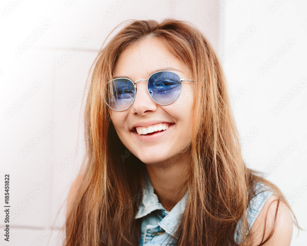 Poster Close up portrait of cheerful red hair hipster girl going crazy making funny face and sending kiss.Positive young woman having fun,relaxed and happy.