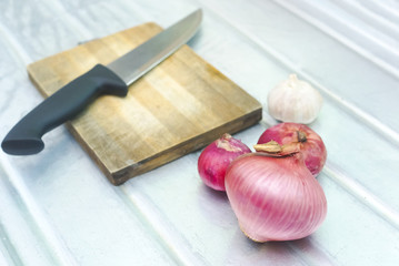 Onions , Knife And Chopping Board 