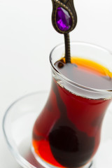 Turkish tea in traditional glass isolated on white background
