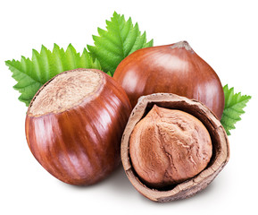 Hazelnuts, kernel of hazelnut and green leaves. Clipping path.