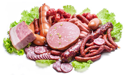 Variety of dry cured sausage products and meat.