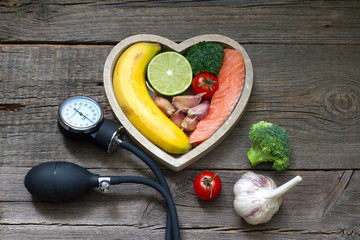 Health heart diet food concept with blood pressure gauge

