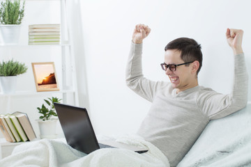 men with laptop at home