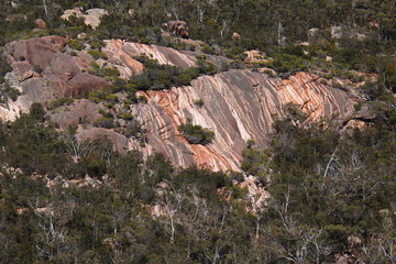 Colorful rocks on Hazards Beach Circuit in Freycinet NP in Tasmania
