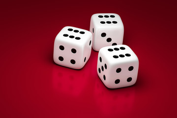 three white dice on a red background
