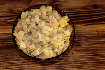 Salad with white kidney beans, potatoes, chicken meat, eggs and mayonnaise