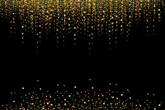 Gold glitter, snowing or raining of grainy particles. Explosion of festive confetti. Overlay texture, isolated on black background