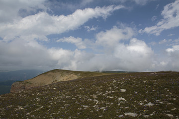 Russia, time lapse. The formation and movement of clouds over the summer slopes of Adygea Bolshoy Thach and the Caucasus Mountains