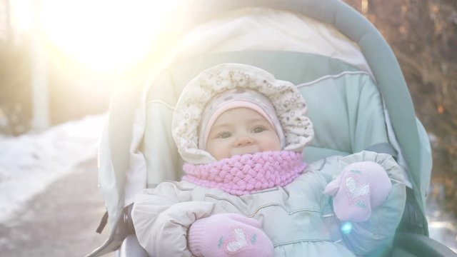 Cute little girl in the pram closeup.