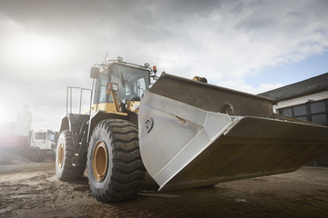 Excavator moving sand