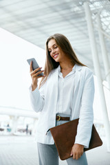 Business Woman With Phone On Street.