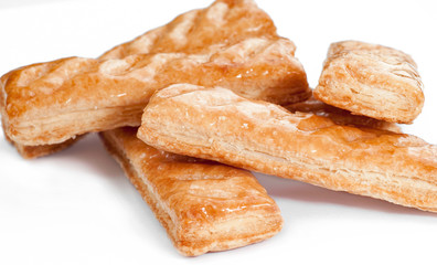 close up view of sweet Puff pastry on white