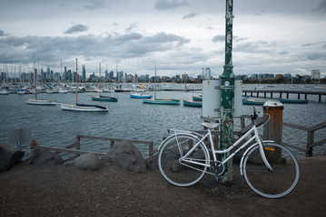 White bicycle at St Kilda Pier on cloudy weather in Melbourne