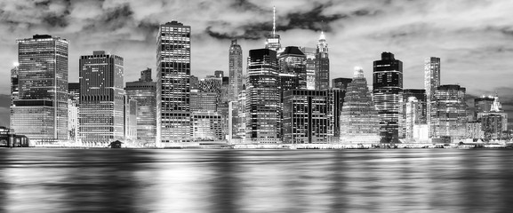 Black and white New York City skyline at night, USA..