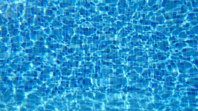 Blue water in pool. Beautiful background. Slow motion Close up