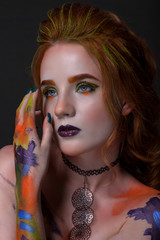 Portrait of a beautiful woman with a creative style