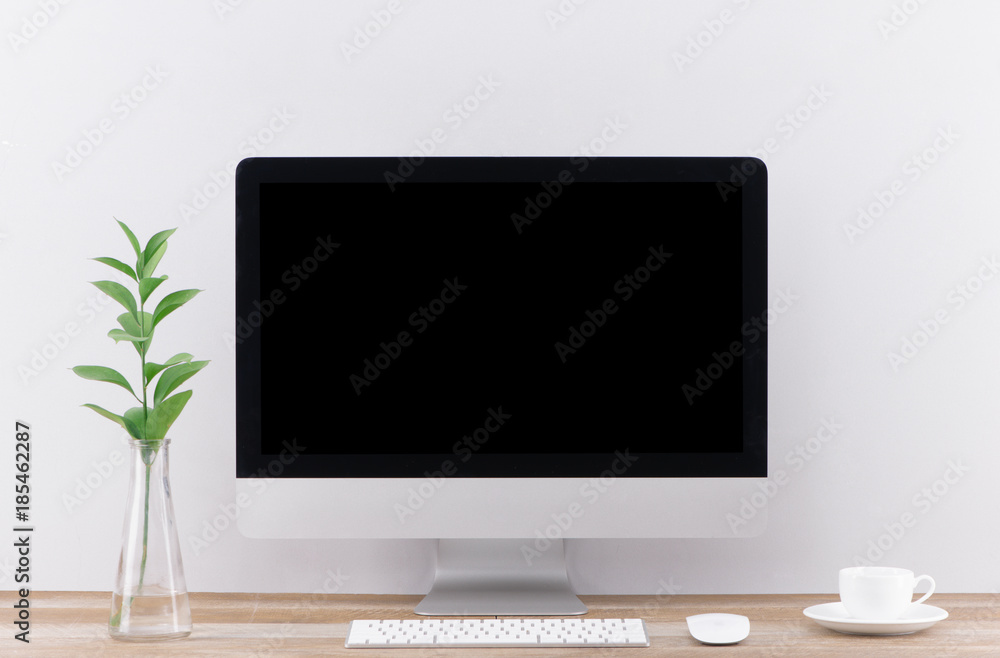 Poster workplace with computer on table in modern room