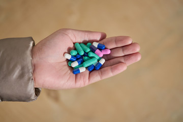 Two-piece, hard starch medicine capsules  in woman hand
