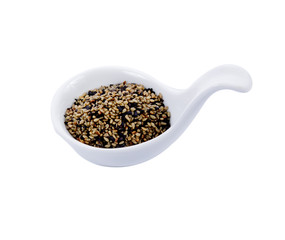 Sesame seeds in white spoons isolated on white background