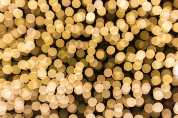 golden bokah Christmas lights abstract background texture.