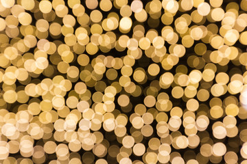 golden bokah Christmas lights abstract background texture.