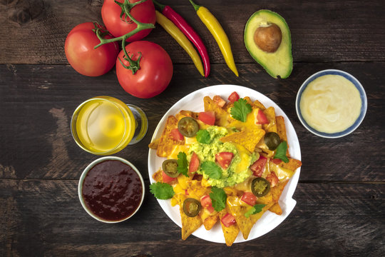 Nachos with cheese, traditional Mexican snack, with ingredients
