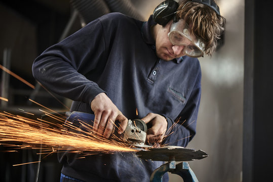 young farmer working with a grinder