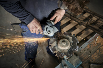 young farmer working with a grinder