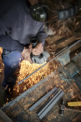 young farmer working with a grinder