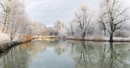 Pond in a snow-covered public park in Kaliningrad, Russia