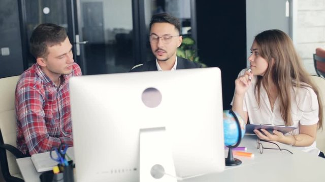 Group of young business people working together in creative office