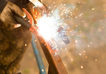 sparks from welding work - obrazy, fototapety, plakaty