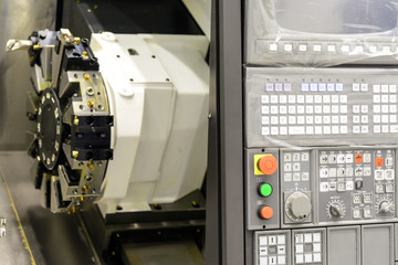 Close up of the CNC lathe panel .CNC lathe or CNC turning machine. Hi-precision CNC machining concept.