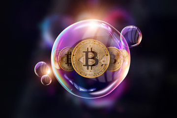 Gold Coins Bitcoin in a soap bubble. The concept of instability of the crypto currency, electronic...