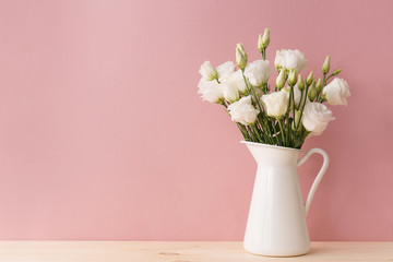 White roses in vintage vase