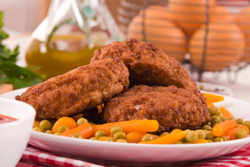 Meatballs on white dish.