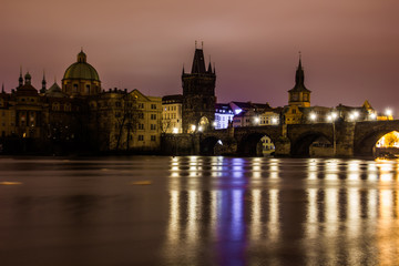 Fototapeta na wymiar Charles bridge in Prague with lanterns at night