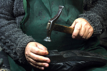 Shoemaker homeworkers.Small business in Russia - forced servitude?Running very old equipment.the hands of Salonika.