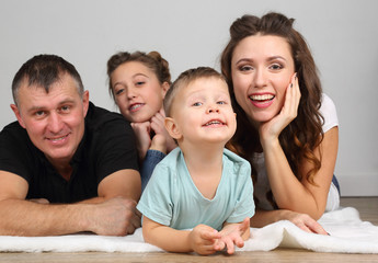 portrait of young family with kids.