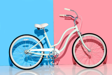 View of city bike on pink and blue background © LIGHTFIELD STUDIOS